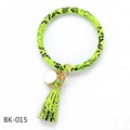 Detail of neon snake pattern PU leather bracelet keychain with gold tassel and white disc tag - Neon Green Snake (BK-015)