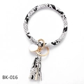 Detail of black and white snakeskin PU leather keychain bracelet with tassel and gold ring - Black White Snake Print (BK-016)