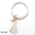 Detail view of a white PU leather O-ring keychain bracelet with golden clip and tassel - Solid White (BK-018)