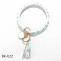 Close-up of PU leather O-ring keychain with cactus print, tassel, and gold clasp - White Cactus (BK-022)
