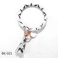 Detail of PU leather wristlet keychain with black ink pattern, tassel, and gold ring - Black White Ink Splash (BK-021)