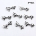 Détail macro de huit breloques lunettes argent antique pour bijoux DIY 2x0.9cm - Style en Forme de Lunettes (B1-5404)