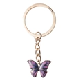 Detailed close-up of a gold butterfly keychain with purple-blue gradient enamel wings - Single Butterfly Style / Purple