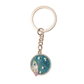 Detail of space-themed keychain with rocket, moon and stars on blue glitter metal - Planet Rocket