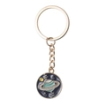 Detail of a golden metal space keychain featuring a Saturn enamel pendant on white background - Space Planet