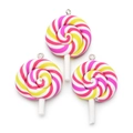 Macro shot of three pink and yellow clay lollipop charms with metal loops for DIY jewelry - Pink Yellow White Spiral (B33-0501)