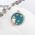 Round enamel astronaut rocket pendant in gold-plated alloy with blue starry sky theme - Starry Sky Rocket (AK3304)