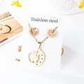 Detailed view of stainless steel jewelry set featuring hollow moon and rabbit charms - Rabbit Style