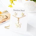 Detail showing golden stainless steel windmill necklace and stud earrings jewelry set - Windmill Style