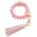 Pink floral bead keychain bracelet with hexagonal wood bead and faux leather tassel - Pink