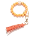 Floral yellow wooden bead keychain bracelet with golden clip and orange tassel pendant - Orange