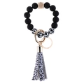 Cow print beaded keychain bracelet with silicone beads, wood bead and leather tassel - Cow Print Black Wood Bead Bracelet Keychain