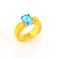 Detailed view of yellow resin ring with a rectangle blue crystal in silver claw setting - Blue Stone Yellow Resin Ring
