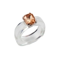 Macro shot of transparent resin ring with champagne rectangular gem in a claw setting - Amber Stone Transparent Resin Ring