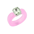 Close-up of pink resin ring featuring a light green square gemstone in a silver setting - Green Stone Pink Resin Ring