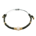 Detail of beaded bracelet featuring a white freshwater pearl and adjustable cord - Navy Blue