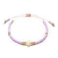 Detail of lavender seed bead bracelet with freshwater pearl and gold accents - Light Purple