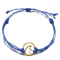 Handmade bohemian beach wave bracelet featuring blue wax cord and gold wave charm - Blue
