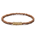 Dettaglio di bracciale boho con perline rotonde in rame e accenti quadrati dorati - Caffè