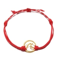 Detail of red handmade braided rope bracelet with a gold circular wave pendant charm - Red