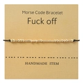 Morsecode armband met gouden kralen en zwart koord op een kraftpapieren kaart - FUCK OFF