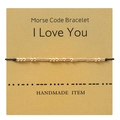 Golden Morse code bracelet on kraft card with 'I Love You' message and black cord - I LOVE YOU