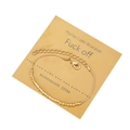 Golden Morse Code Bracelet with beads and tube beads on a handmade paper display card - Fuck Off Theme