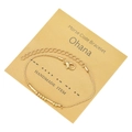 Dettaglio delle perle Morse sul bracciale dorato con carta Ohana e chiusura a moschettone - Tema Ohana