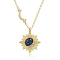 Star and moon gold necklace with sunburst pendant and blue enamel starburst details - Necklace