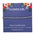 Detailed view of Morse code bracelet with silver beads on floral display card - FLOWER GIRL