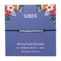 Detail of SOBER Morse Code Bracelet with silver beads on a floral gift card display - SOBER
