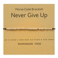 Gold Morse Code bracelet on gift card featuring Never Give Up message with black cord - Never Give Up