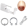 Detail van 4-delige body piercing kit met wit gereedschap, klem en twee zilveren ringen - Neuspiercing Kit / 4-delige set
