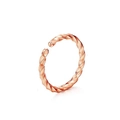 Detail view of rose gold twisted hoop featuring a sleek spiral texture and open design - Rose Gold