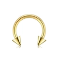 Detail macro view of golden stainless steel horseshoe barbell with spiked ends - Style B Gold