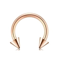 Detailed macro view of a rose gold horseshoe piercing ring with sharp conical spikes - Type B Rose Gold