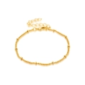 Detail der goldenen Kordelkette Armband mit Goldperlen und sicherem Karabinerverschluss - Perlen-Seilkette / Gold