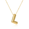 Macro detail of polished gold bubble letter L pendant on a delicate satellite chain necklace - Letter L