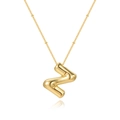 Detailed macro view of a 3D bubble gold letter Z pendant with small star-shaped engravings - Letter Z