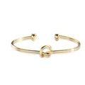 Minimalist 14k gold plated open cuff bracelet featuring a central knot and sphere ends - Knot Design (0094-1)