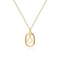 Close-up of golden necklace with double oval letter O pendant on white background - Letter O