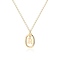 Macro view of gold plated 18K initial R oval pendant with polished delicate chain - Letter R