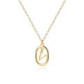 Detailed macro view of 18K gold letter V pendant on a sleek minimalist chain - Letter V