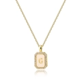 Gold square G letter necklace with shell inlay and pavé zircon crystals on white background - Letter G
