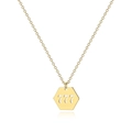 Macro detail of gold-plated lucky number 777 pendant on a delicate cable chain necklace - Gold 777