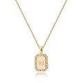 Detail of gold necklace with square M letter shell pendant and zircon stones - Letter M