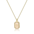 Detailed macro view of gold-plated square letter S pendant with pink enamel and zircons - Letter S