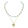 Dettaglio della collana doppia dorata con perline blu e ciondolo tondo a raggiera - Stile Perlina Turchese Raggio di Sole (0453-1)