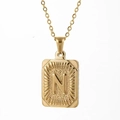 Golden necklace with rectangular letter N pendant featuring hammered texture details - Letter N