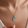 Macro shot of gold necklace featuring a blue enamel moon and mountain scenery pendant - Dark Blue Moon Star Mountain Style (xp-191)